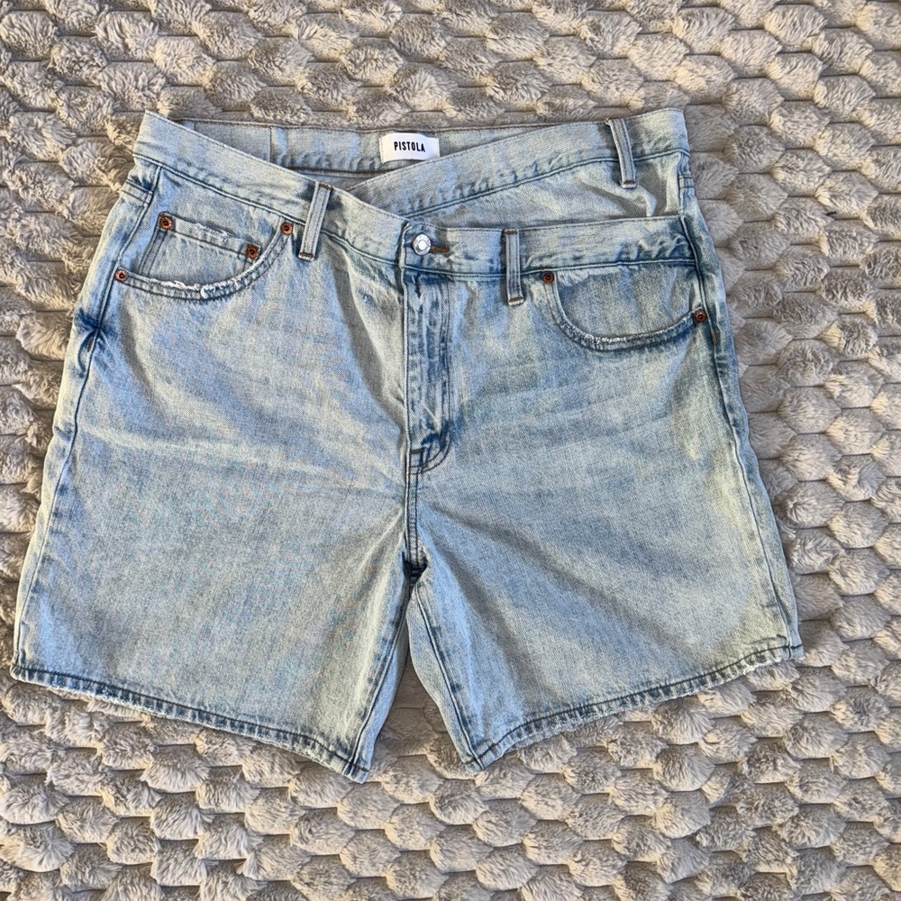 Pistola Denim shorts featuring a unique crossover waist and raw hem